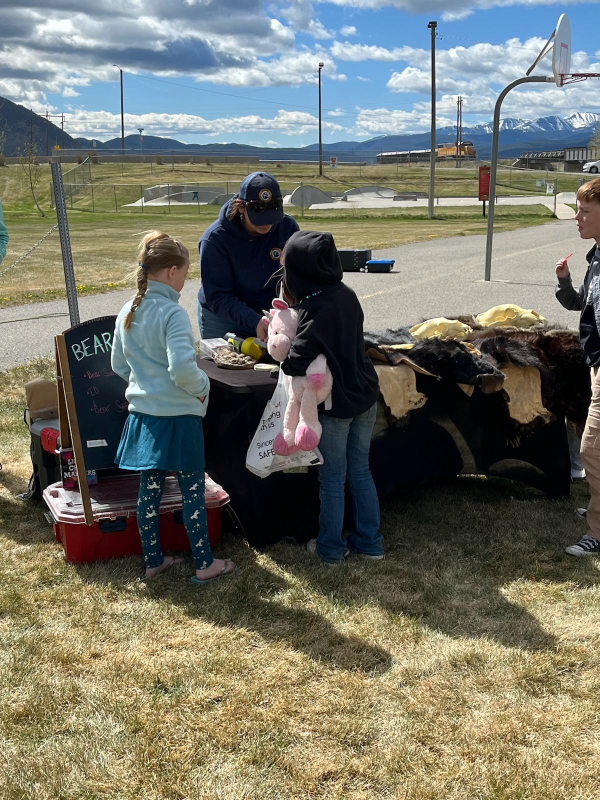 Danielle Oyler, Wildlife Stewarship Outreach Specialist for FWP, teaching kids to be "bear aware" at Outdoor Day